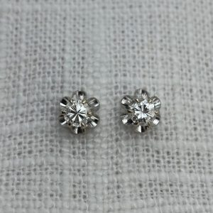 small diamond stud earrings in white buttercup settings